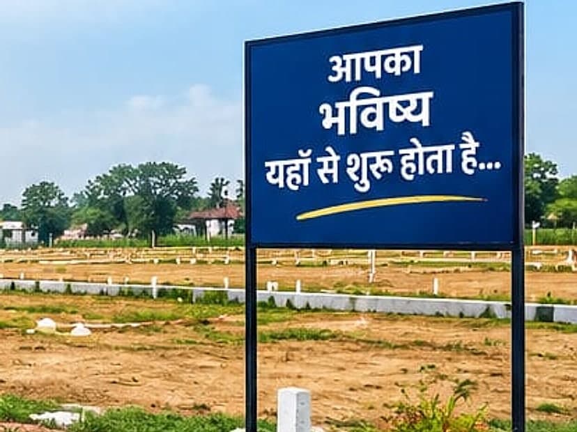 Marked plots with boundary markers and a project signboard at Rampur Chaurasi